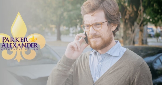 man on phone with the insurance company after a car accident