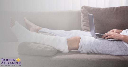 person on the couch with broken leg