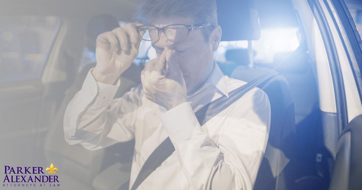 driver rubbing his eyes