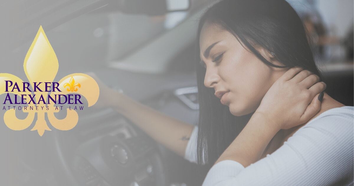 woman holding her neck after being involved in an accident