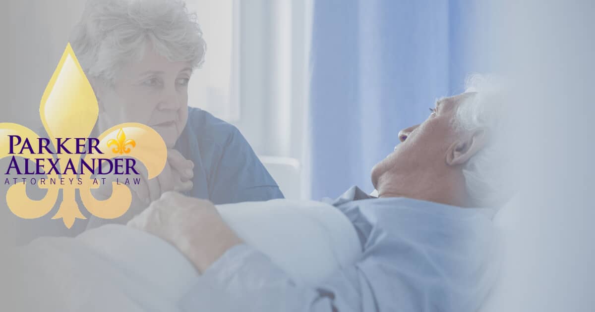 man in hospital with wife by his side