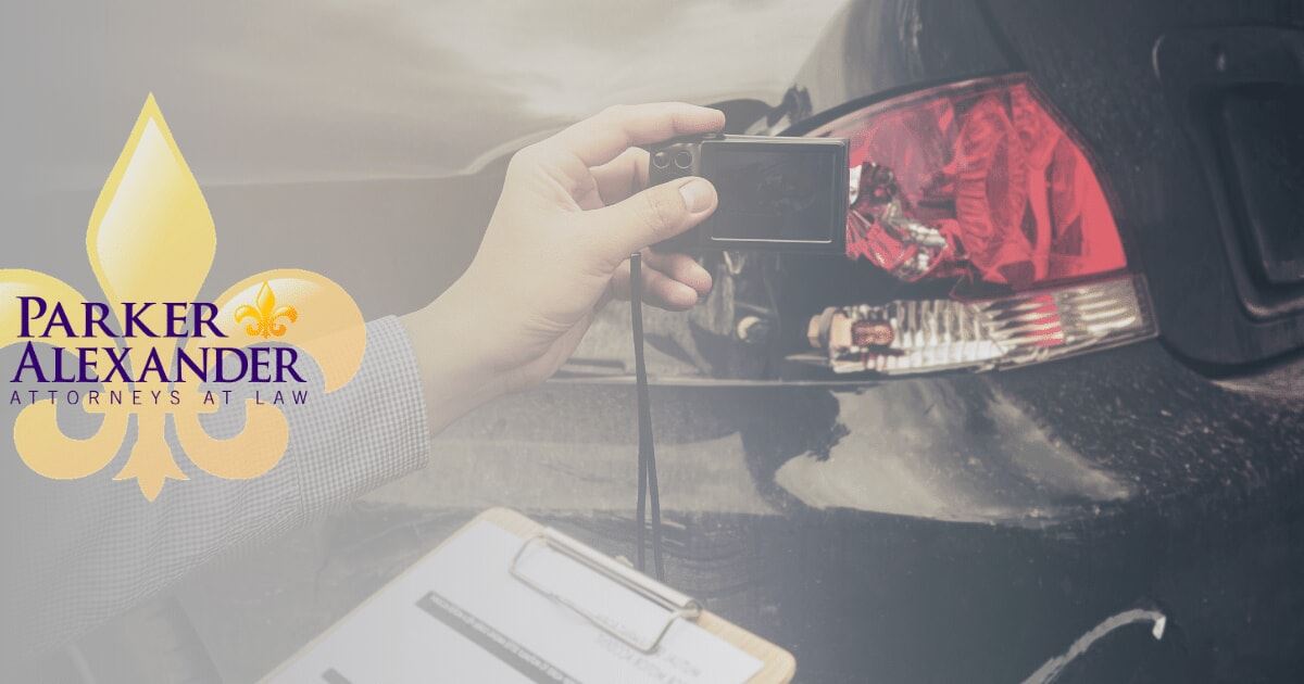 insurance adjuster checking damage on a vehicle